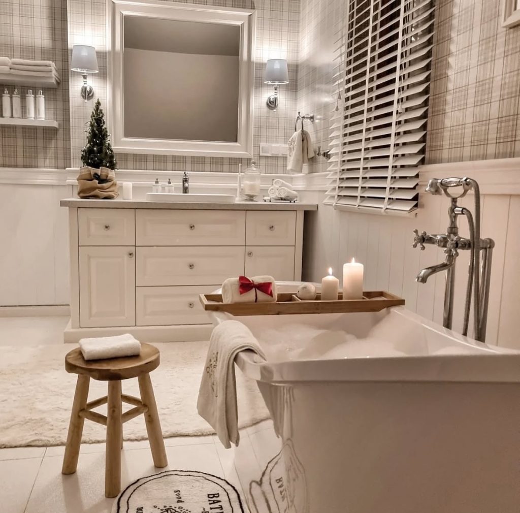 Bathroom featuring plaid Christmas towels and festive decor