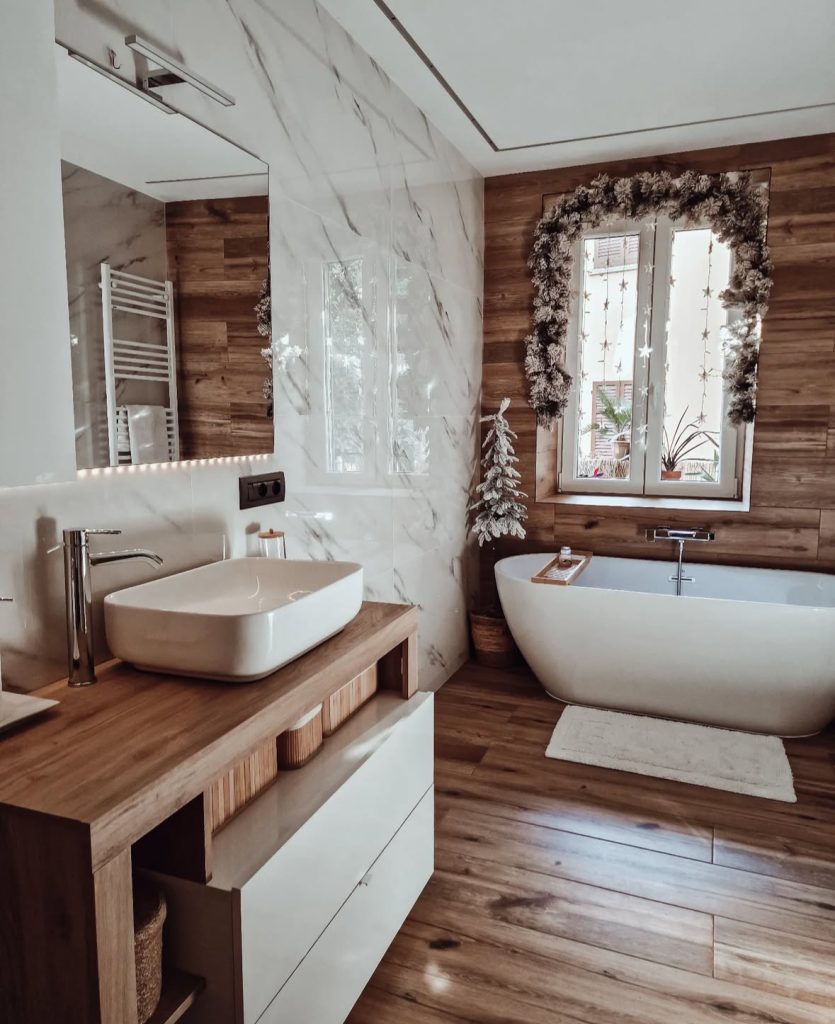 Scandinavian bathroom with wood, marble, and minimalist Christmas decor