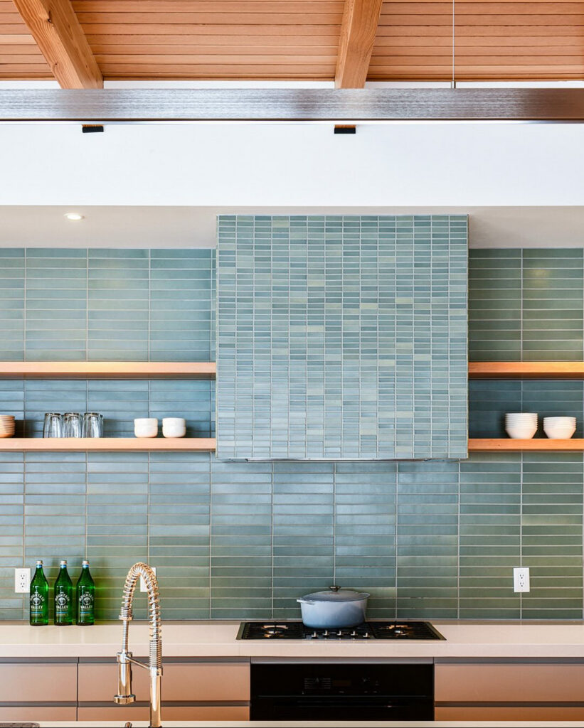 aqua vertical tile open wood shelves sleek cooktop fresh modern lake house kitchen