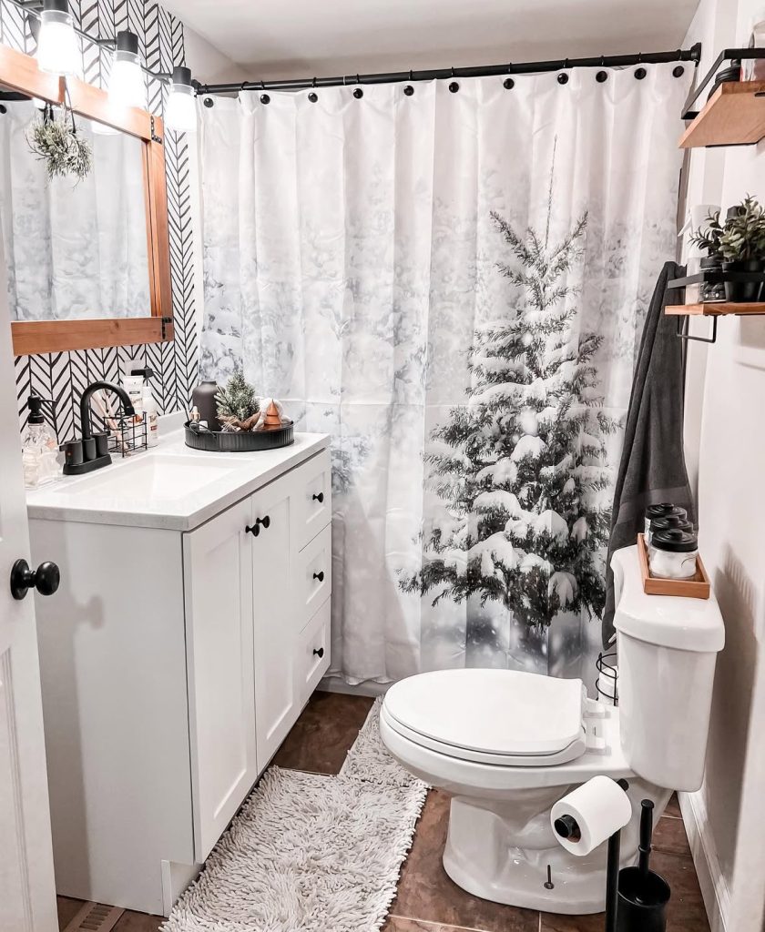 Bathroom shower decorated with snowy forest-themed Christmas decor