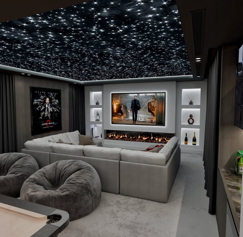 A starry ceiling, oversized sectional, and huge screen make this theater perfect for small man cave ideas focused on movie nights.
