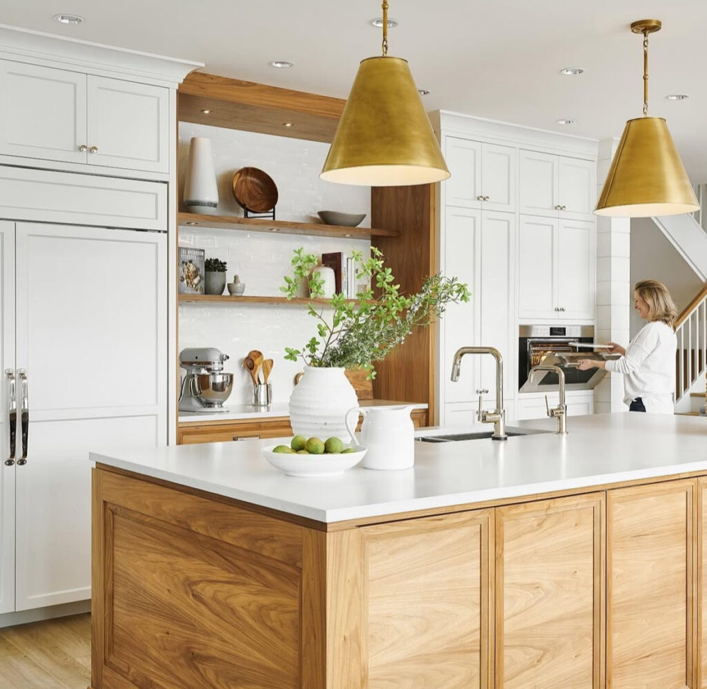 walnut island white cabinetry oversized brass pendants bright welcoming lake house kitchen ideas