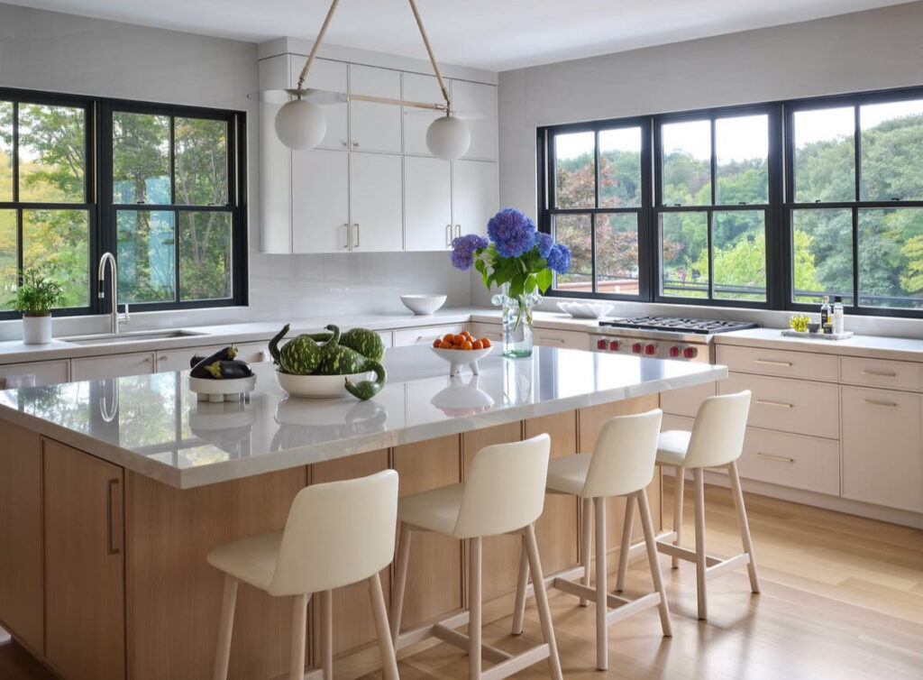 large island walls of glass overlooking water open concept lake house kitchen ideas for entertaining