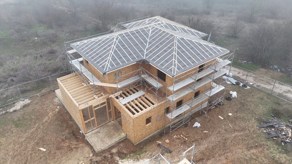 Rothoblaas breathable roofing membrane being installed over rafters before tiles