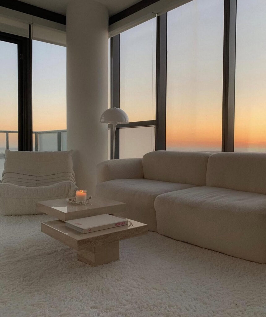 Neutral apartment interior with restrained accent colors layered over a calm base palette