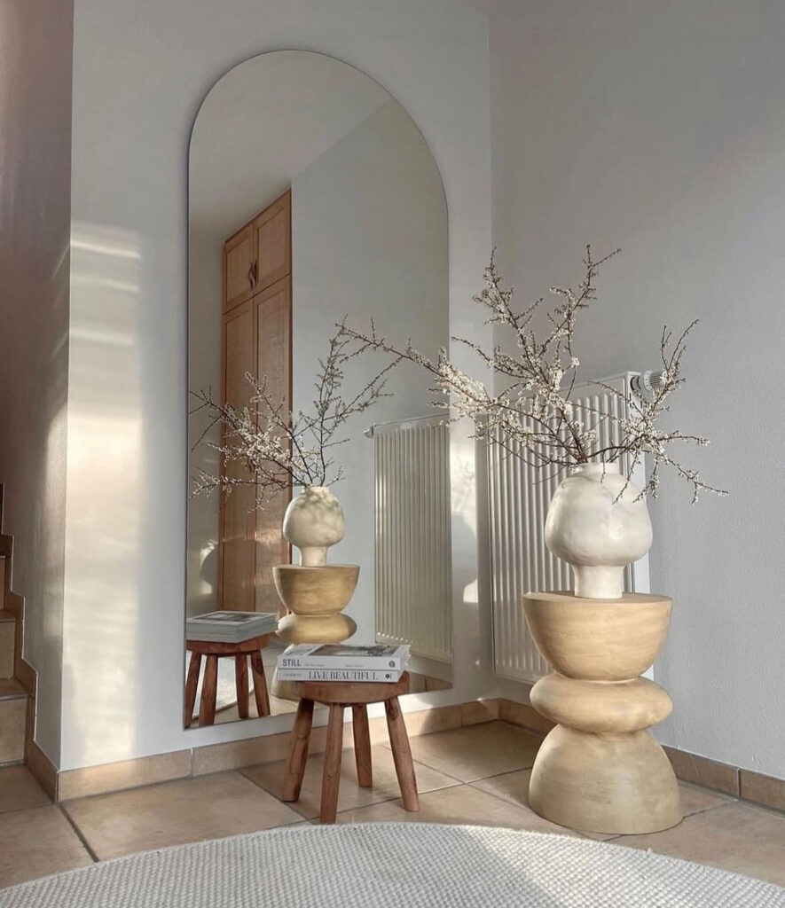 Open-plan apartment showcasing clutter-free design and simple, streamlined furniture.