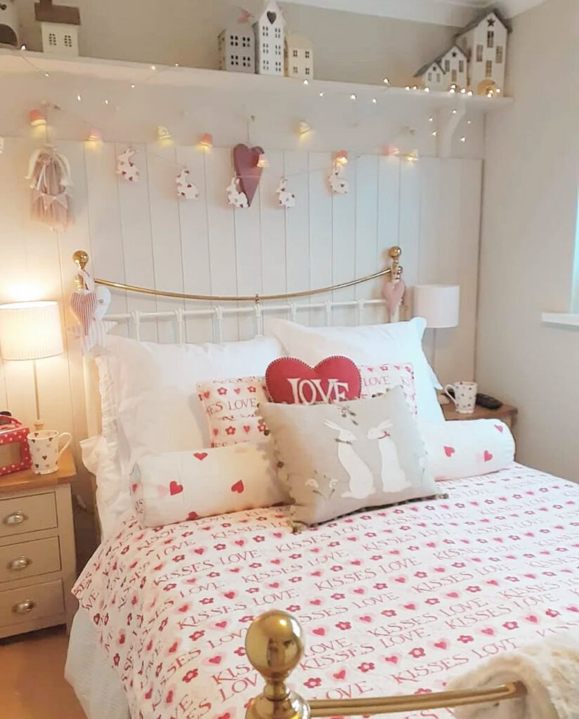 A charming cottage-style bedroom with heart bedding and cute accessories displaying valentines day bedroom decor inspiration.