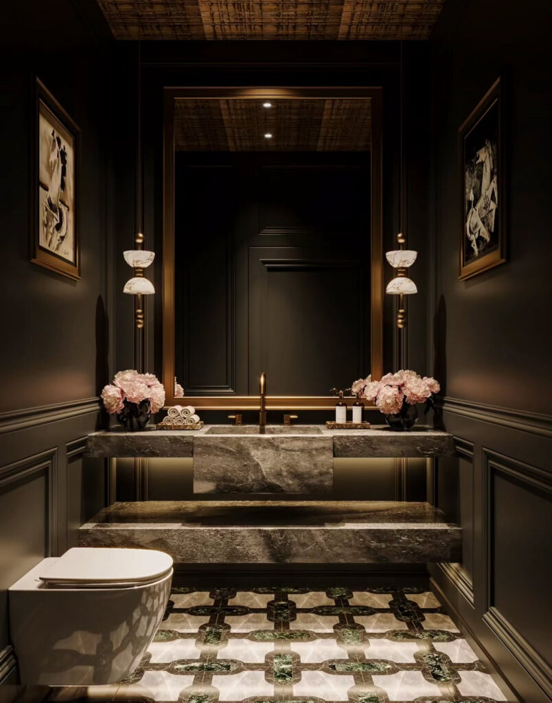 Paneled dark powder room with marble console sink evoking a gothic bathroom style.