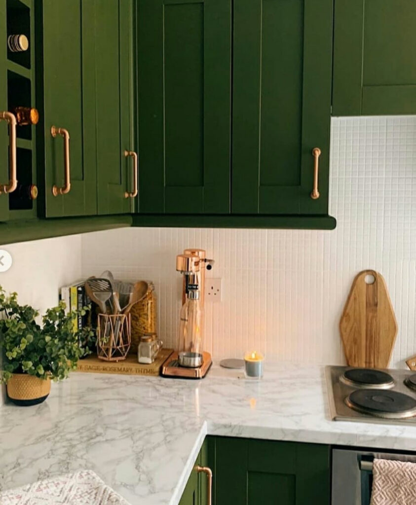 Plain maple kitchen with dark worktops and small mosaic tiles before the budget makeover by @lifewithmolly__.