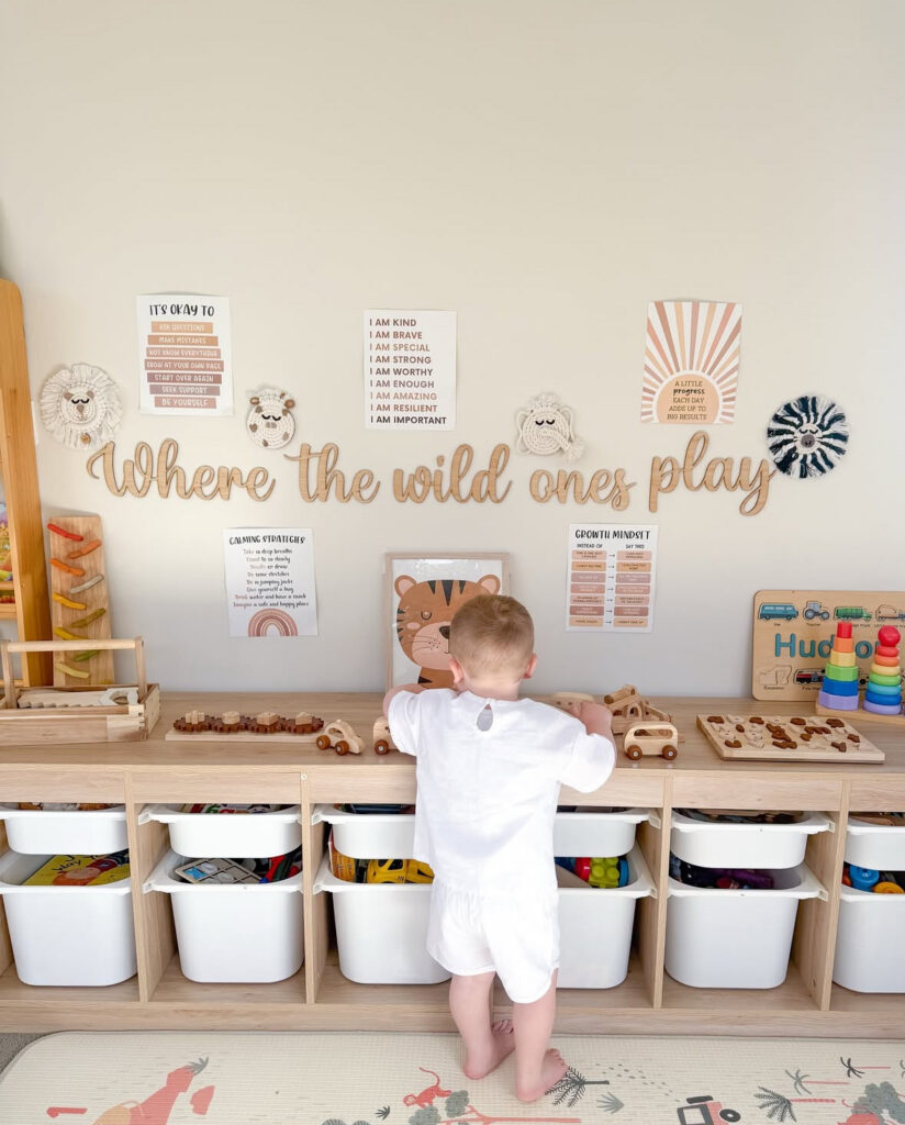 Playroom organization setup using shelves, baskets, and bins to sort toys by activity.