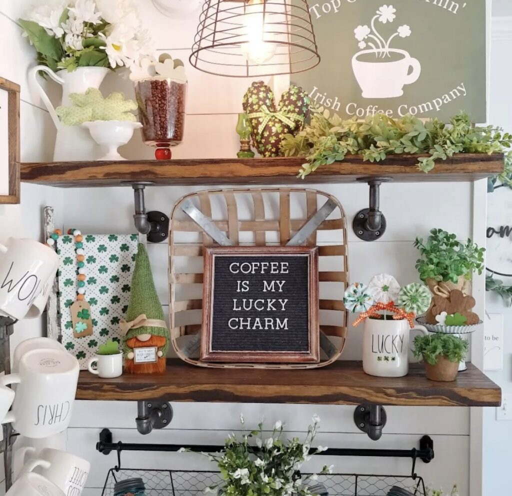 st patricks decor on a cozy coffee station with shamrocks, a gnome, mugs, and a “lucky charm” sign.