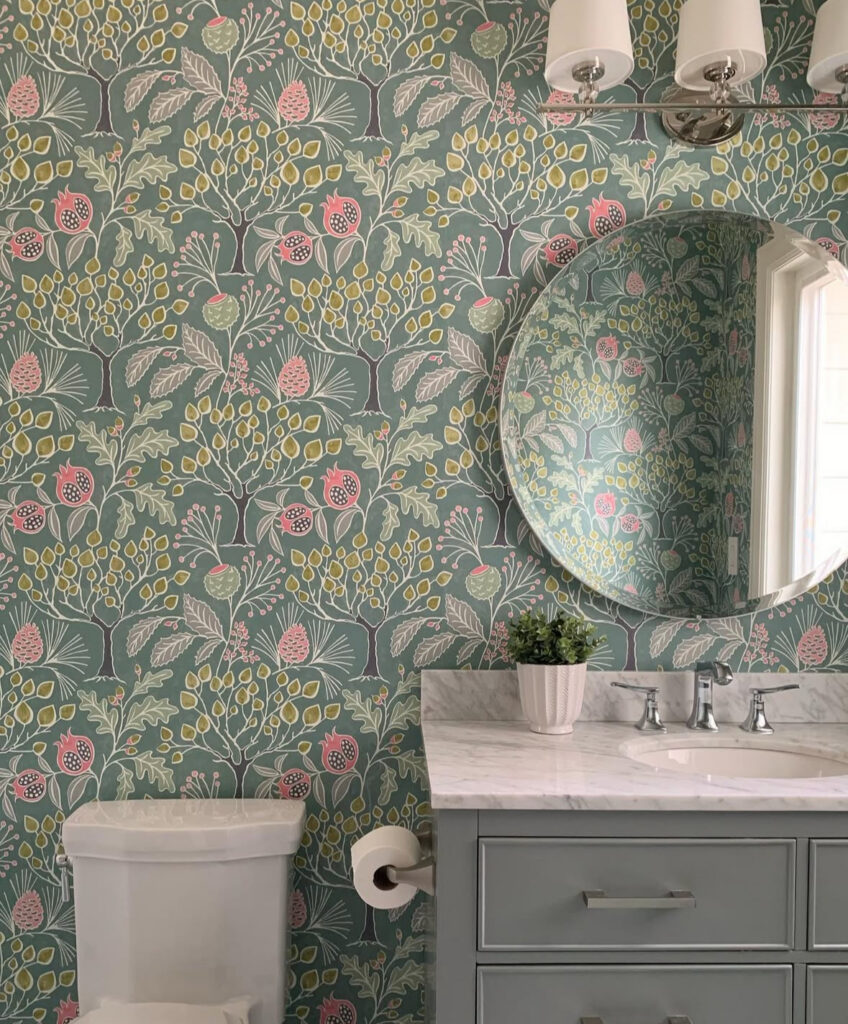 st patricks day ideas in a bathroom with whimsical green wallpaper, a round mirror, and soft pastel details.