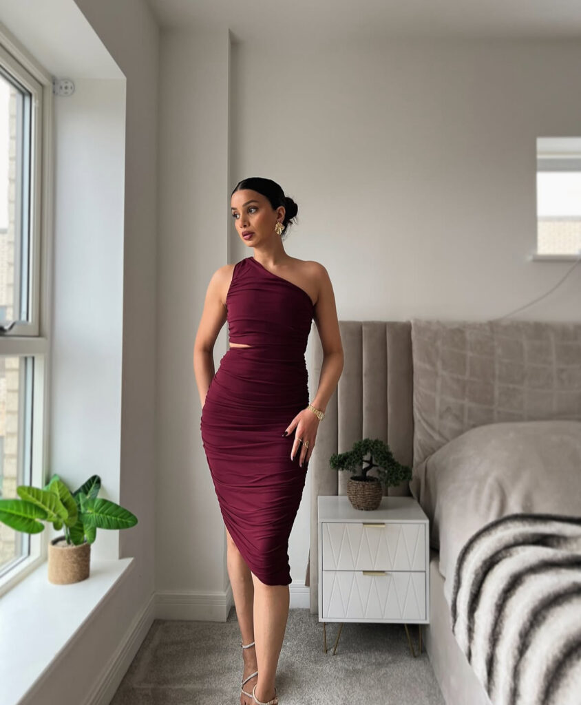 Romantic Valentines Day dress: burgundy one-shoulder midi that feels elevated for dinner plans.