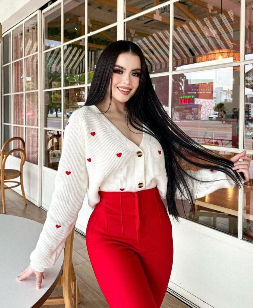 Valentines Day outfit idea: heart cardigan styled with high-waisted red pants for a polished, daytime-to-dinner look.