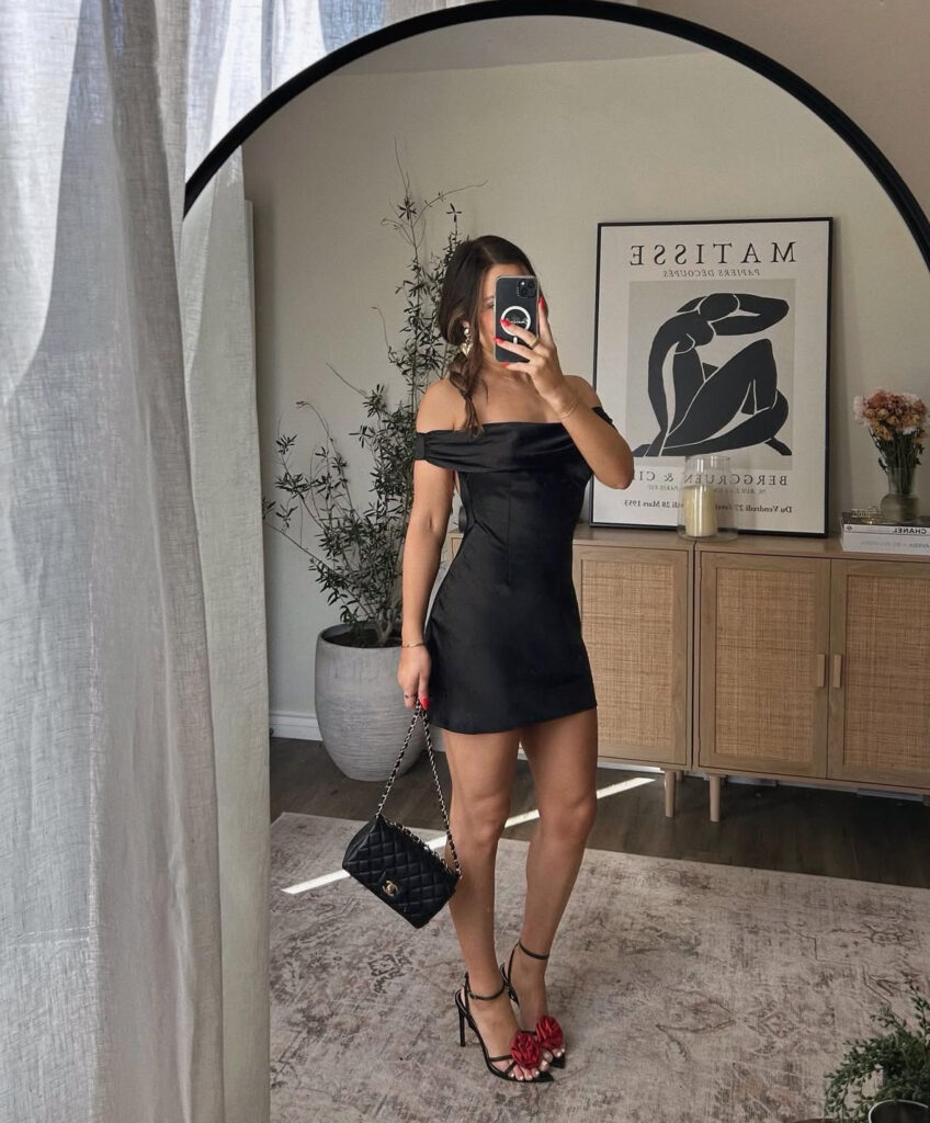 Valentines outfit idea: little black dress made festive with red rose heels (simple silhouette, statement shoes).