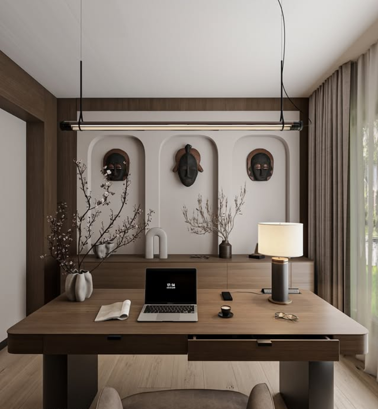 Professional office decor in a modern office lounge with blue seating, a built-in shelving wall, clean color schemes, and soft daylight that supports a refined meeting zone.