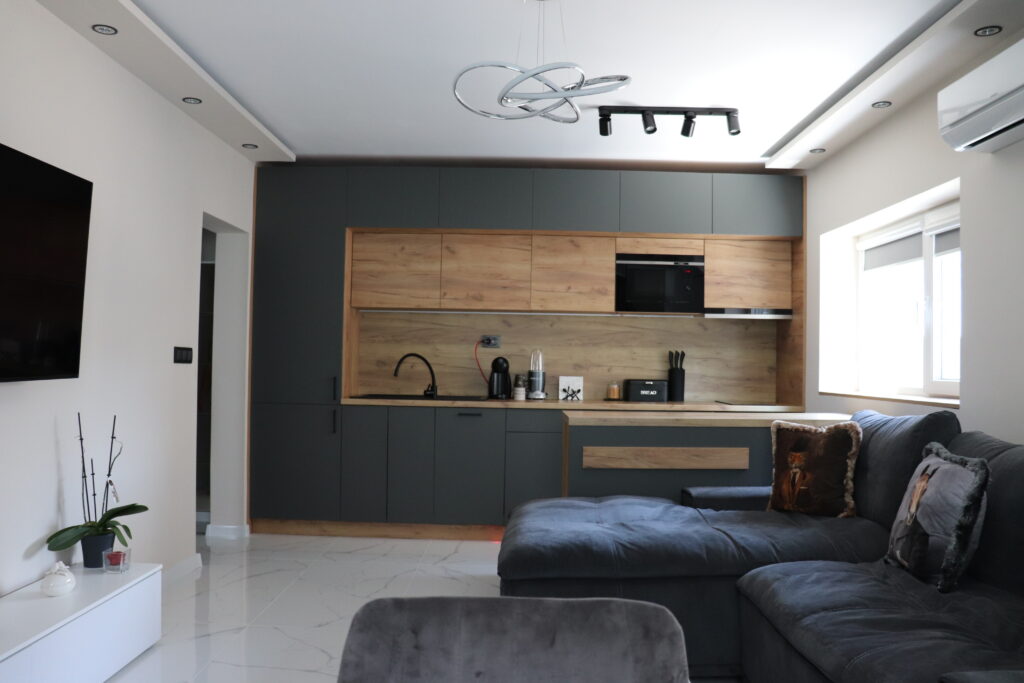 Modern living room with subtle tray ceiling and integrated cove lighting