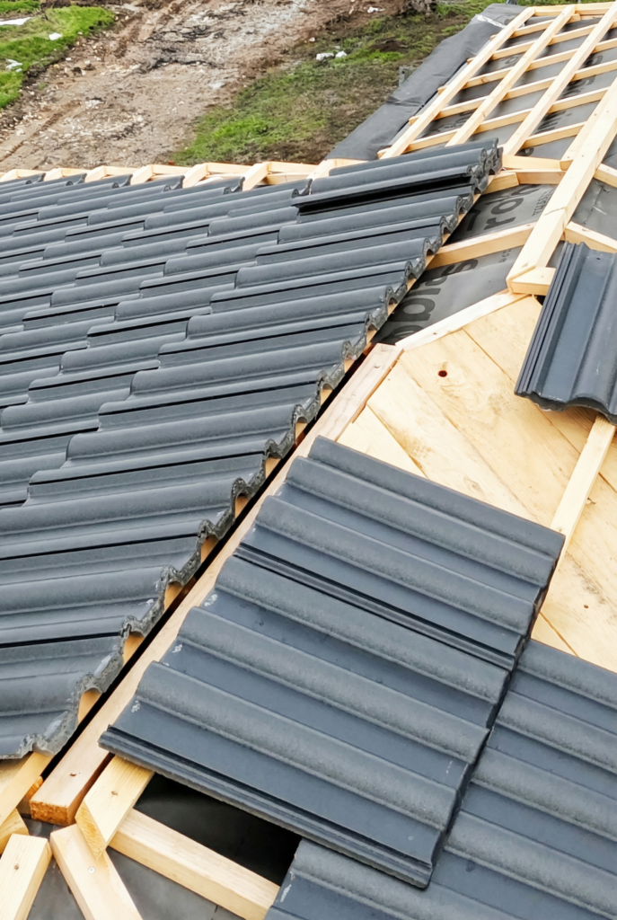 anthracite roof tiles installation progress new build