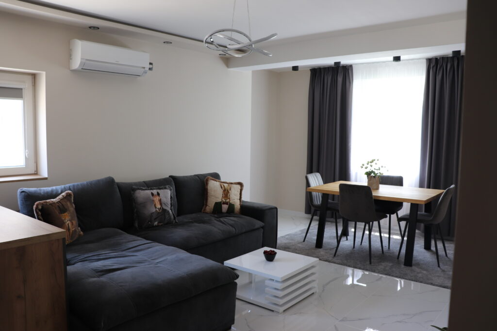 living room with tray ceiling