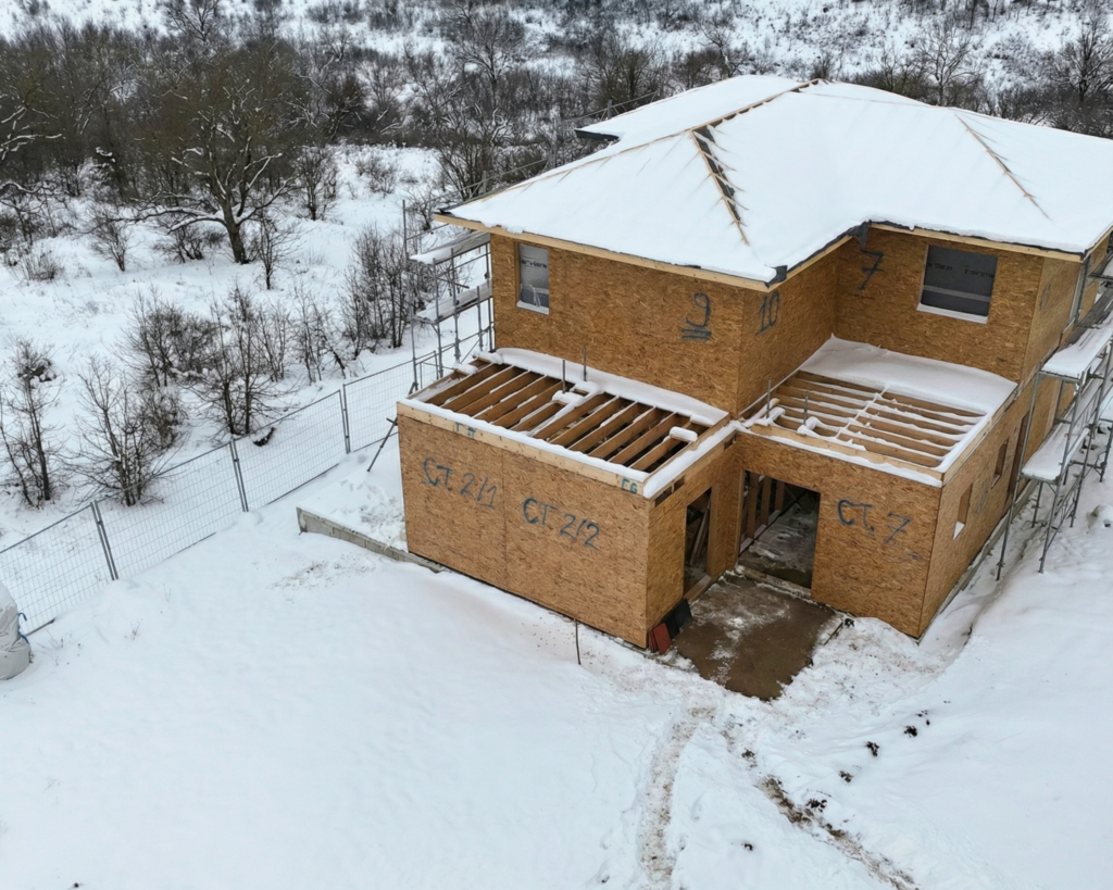 new build house winter no roof snow construction site