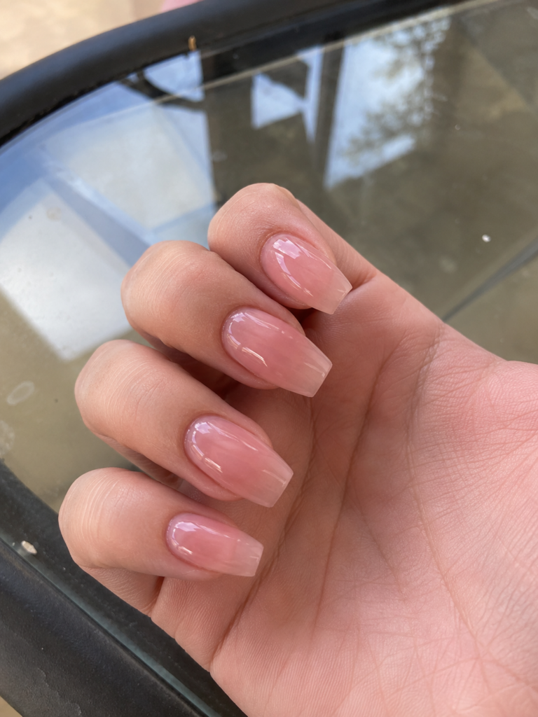 Sheer milky pink jelly finish nails on coffin shaped gel manicure