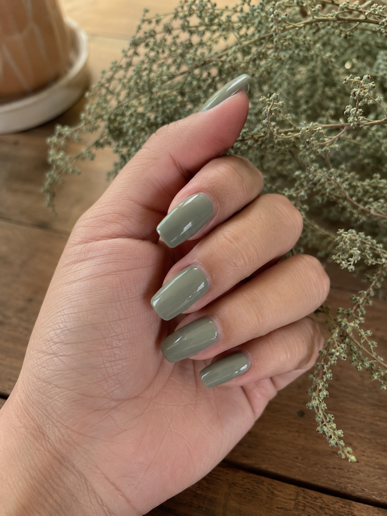 Muted olive sage green gray nails on coffin shaped gel manicure