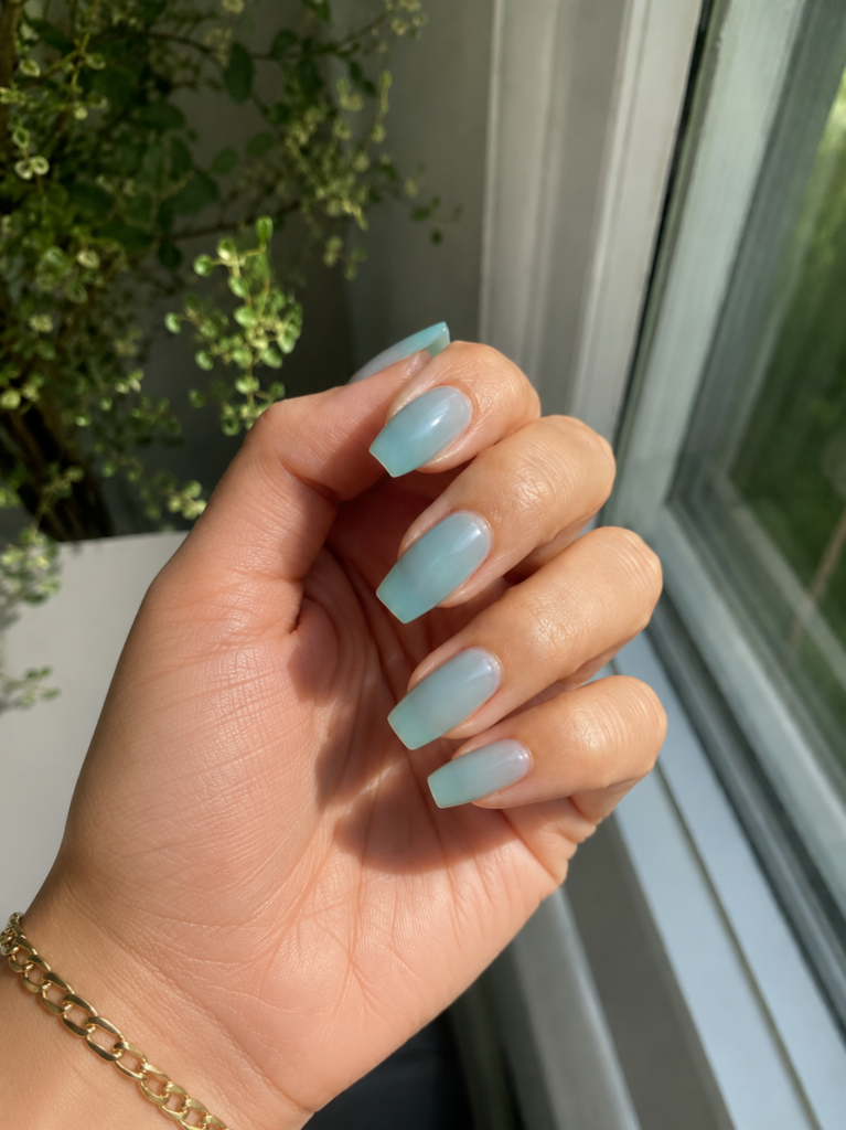 Translucent sea glass blue green nails on coffin shaped gel manicure