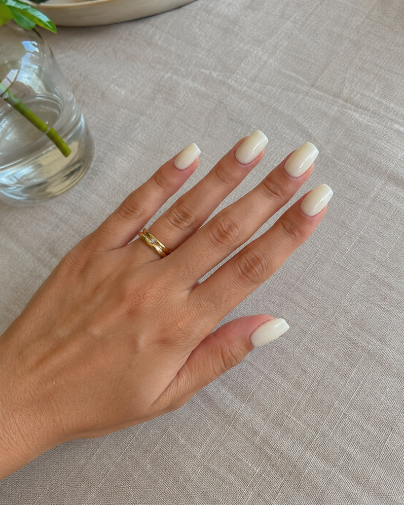 Warm vanilla cream off white nails on coffin shaped gel manicure
