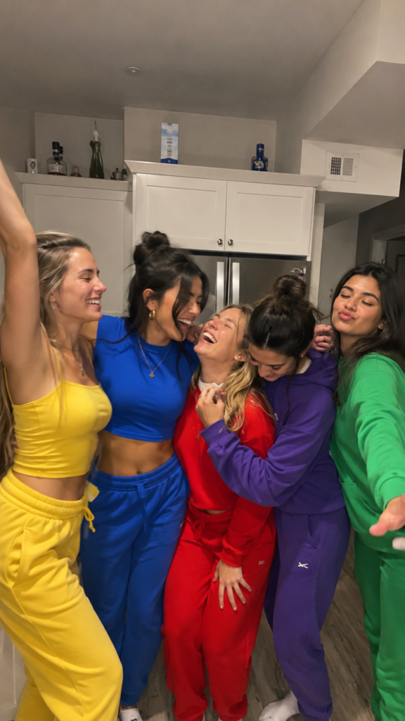 Five friends each dressed in a single bold color for an emotions-themed group Disney Halloween costume