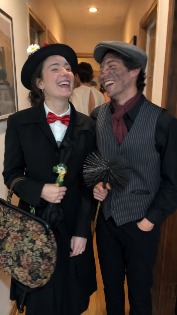 Two friends in a coat and hat with an umbrella and a striped chimney-sweep outfit, Mary Poppins and Bert Disney Halloween costume