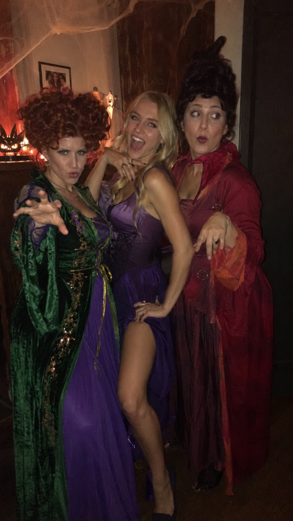 Three friends in witch costumes posing dramatically, Hocus Pocus Sanderson Sisters Disney Halloween costume
